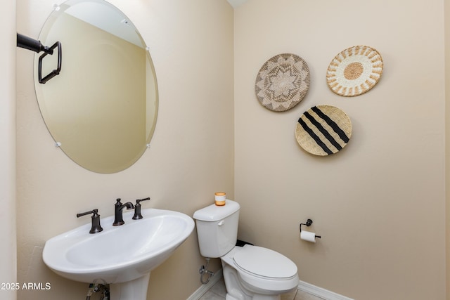 bathroom featuring sink and toilet