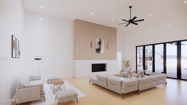 33962 N Cole Ranch Rd, Queen Creek, AZ 85144 - living room with light wood-style floors, a ceiling fan, a towering ceiling, and recessed lighting