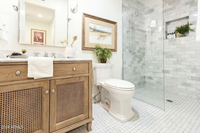 bathroom featuring vanity, toilet, and a shower with shower door