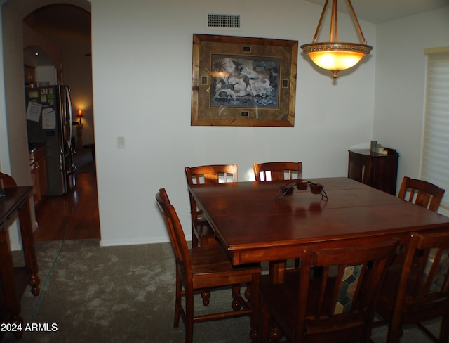 4506 E Lone Cactus Dr, Phoenix, AZ 85050 - dining space featuring visible vents, arched walkways, carpet, and baseboards