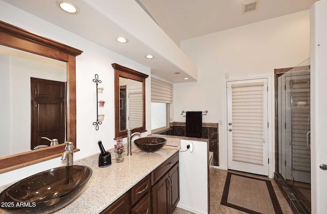 4506 E Lone Cactus Dr, Phoenix, AZ 85050 - full bathroom featuring double vanity, recessed lighting, and a shower stall