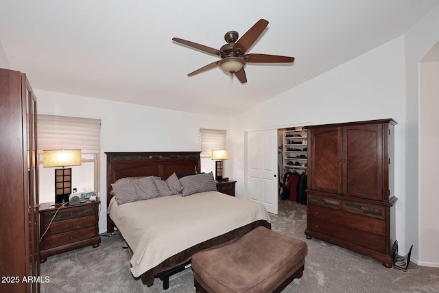 4506 E Lone Cactus Dr, Phoenix, AZ 85050 - bedroom featuring carpet flooring, lofted ceiling, a closet, arched walkways, and a ceiling fan