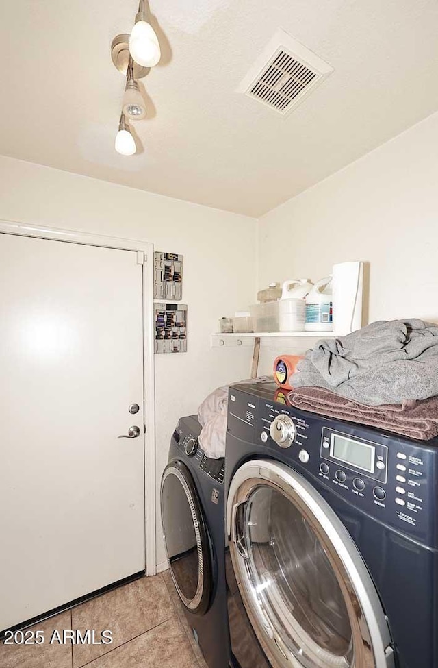 4506 E Lone Cactus Dr, Phoenix, AZ 85050 - washroom featuring independent washer and dryer and light tile patterned floors