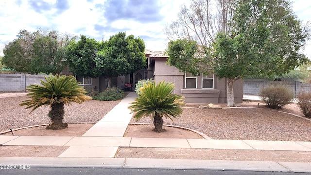 view of property hidden behind natural elements