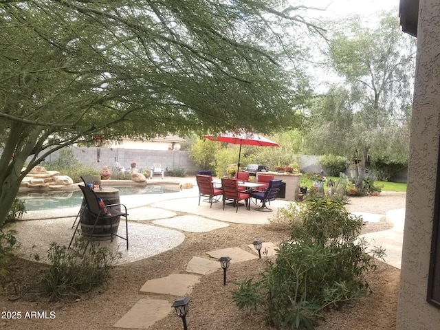 exterior space featuring a patio area and a pool