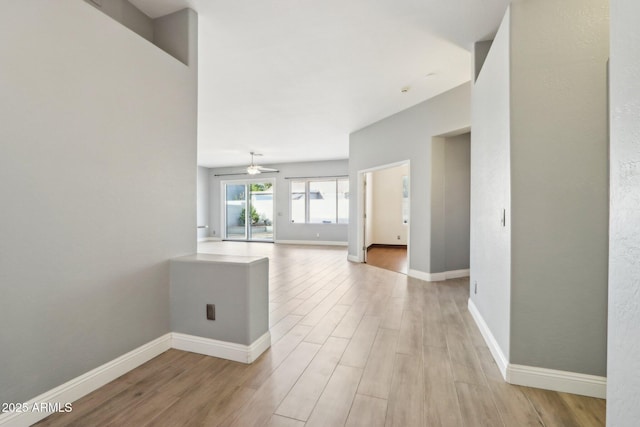 interior space with ceiling fan and light wood-type flooring