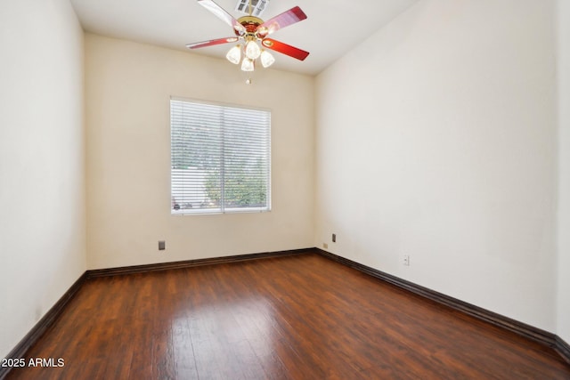 unfurnished room with dark hardwood / wood-style floors and ceiling fan