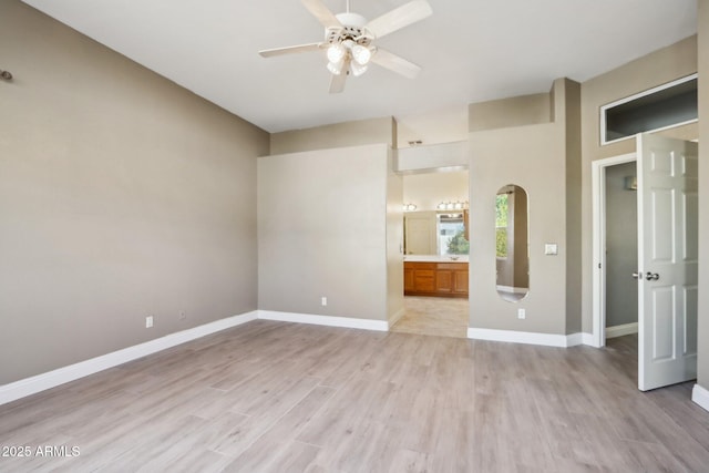 unfurnished room with ceiling fan and light wood-type flooring