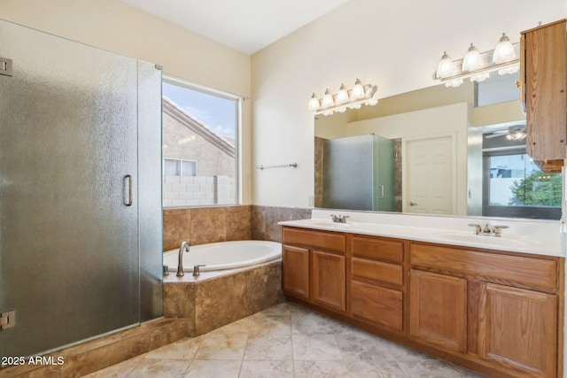 bathroom with tile patterned floors, ceiling fan, vanity, and shower with separate bathtub