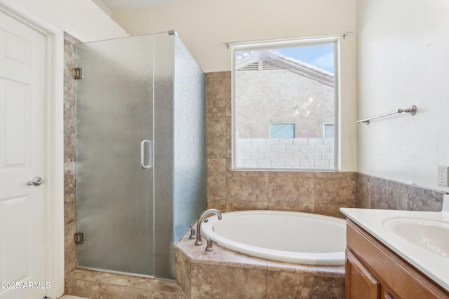 bathroom featuring separate shower and tub and vanity