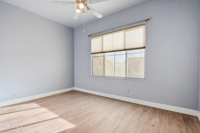 unfurnished room featuring ceiling fan and light wood-type flooring