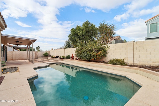 view of pool with ceiling fan and a patio area