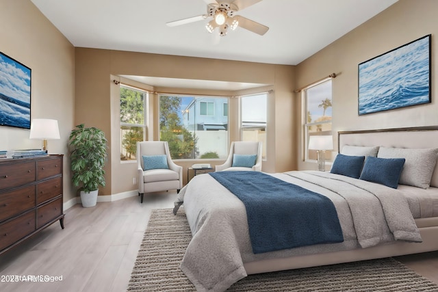 bedroom featuring light hardwood / wood-style flooring and ceiling fan