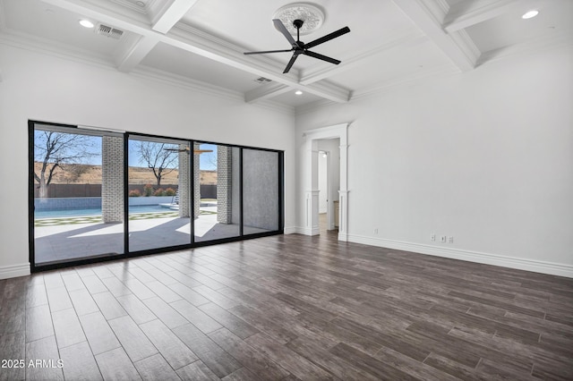 unfurnished room featuring visible vents, beamed ceiling, and wood finished floors