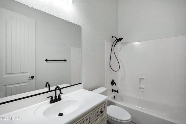 full bath with shower / tub combination, vanity, and toilet