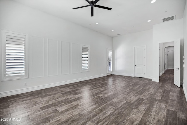 empty room with recessed lighting, visible vents, baseboards, a ceiling fan, and dark wood-style floors