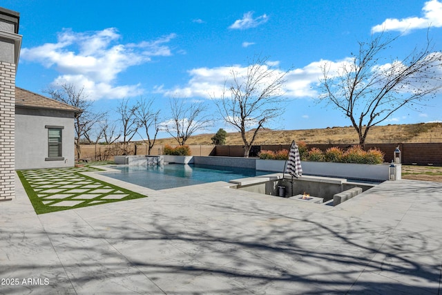 view of swimming pool with a patio area, a fenced backyard, and a fenced in pool