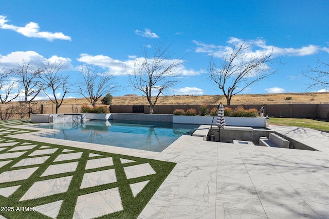 view of swimming pool with a fenced in pool, a patio area, and a fenced backyard