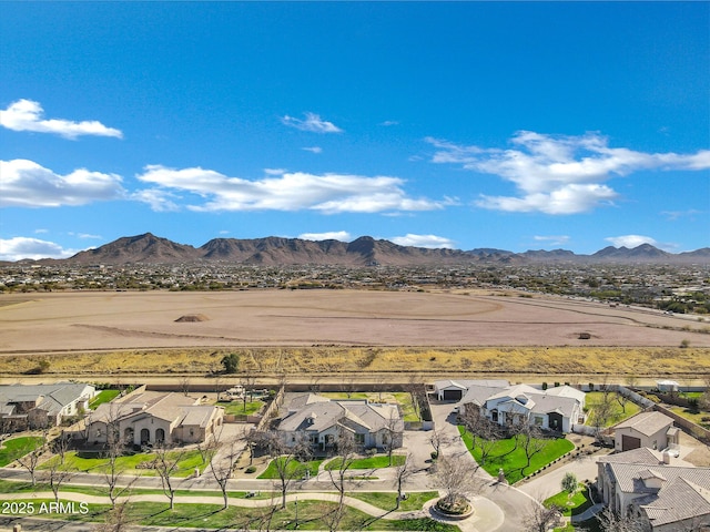 drone / aerial view featuring a residential view and a mountain view