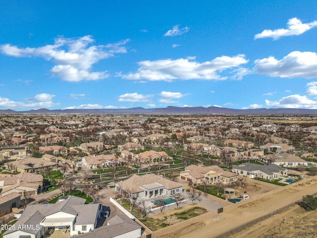 drone / aerial view featuring a residential view and a mountain view