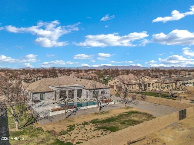 exterior space with a residential view and a mountain view