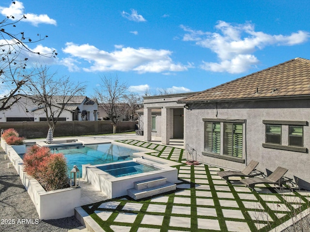 view of pool featuring an in ground hot tub, a patio, a fenced backyard, and a fenced in pool