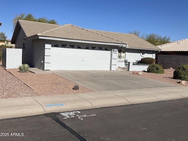 ranch-style home with a garage