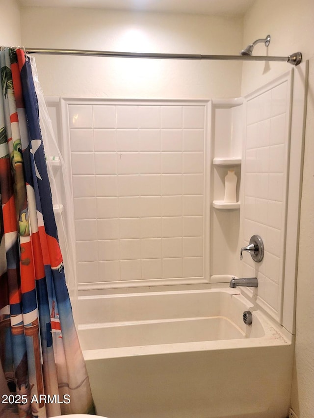 bathroom with toilet and shower / tub combo with curtain