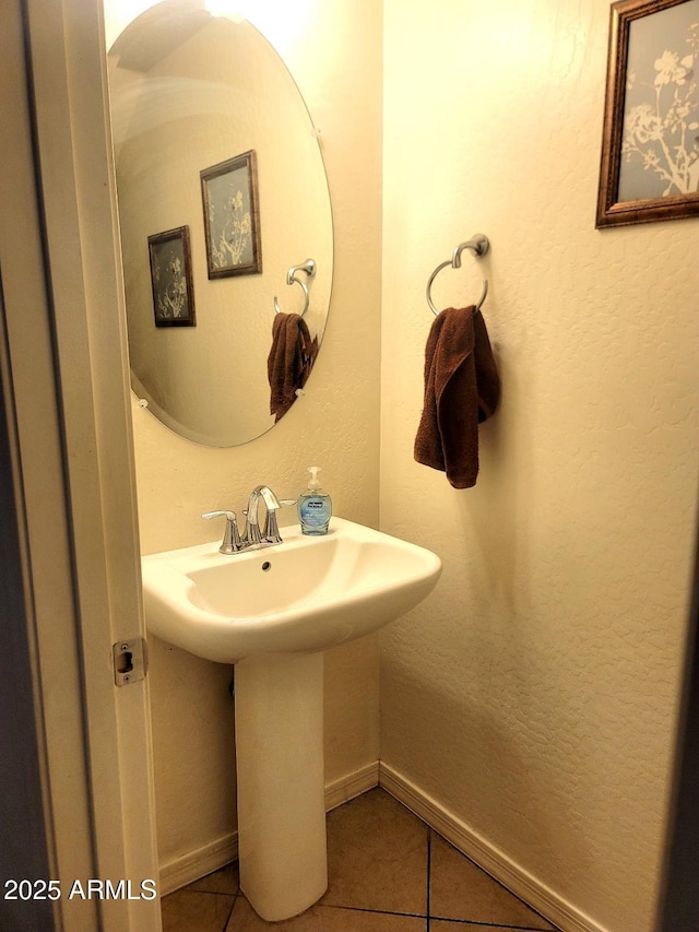 bathroom with tile patterned floors and sink