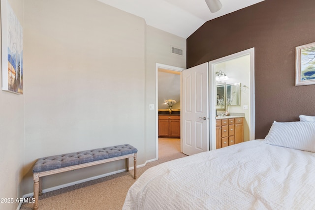 67 W Sarah Ln, Tempe, AZ 85284 - bedroom featuring light colored carpet, lofted ceiling, connected bathroom, baseboards, and a ceiling fan