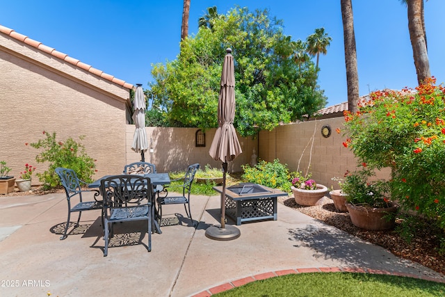 67 W Sarah Ln, Tempe, AZ 85284 - fenced backyard with a patio, a fire pit, and outdoor dining area