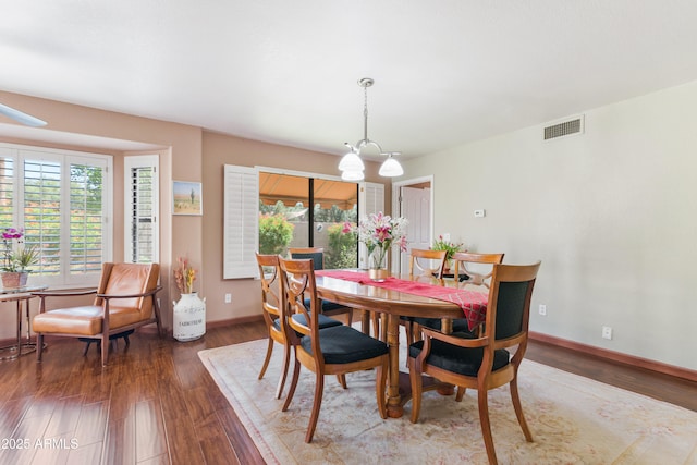 67 W Sarah Ln, Tempe, AZ 85284 - dining room with wood finished floors, baseboards, and a chandelier