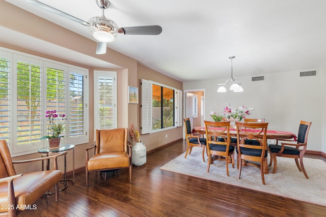 67 W Sarah Ln, Tempe, AZ 85284 - dining area with baseboards, wood finished floors, a ceiling fan, and a chandelier
