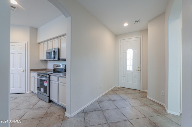 entrance foyer with light tile patterned flooring