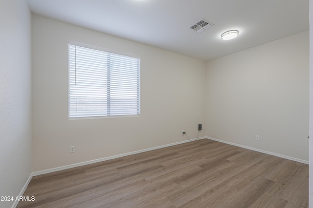 empty room with light hardwood / wood-style floors