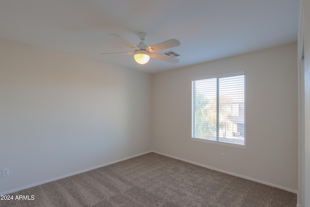 unfurnished room featuring carpet flooring and ceiling fan