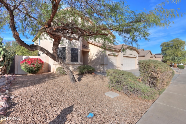 view of front of property with a garage