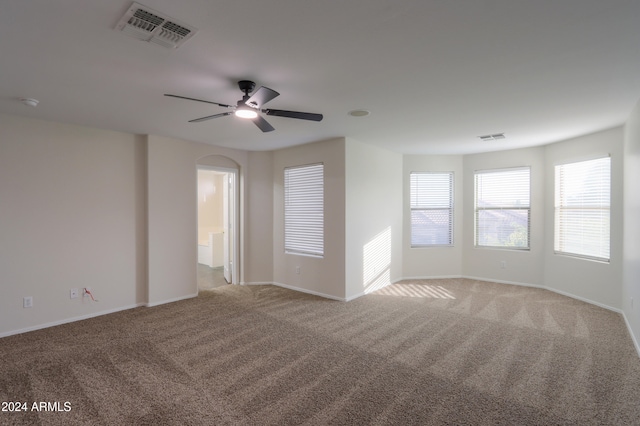 carpeted empty room with ceiling fan