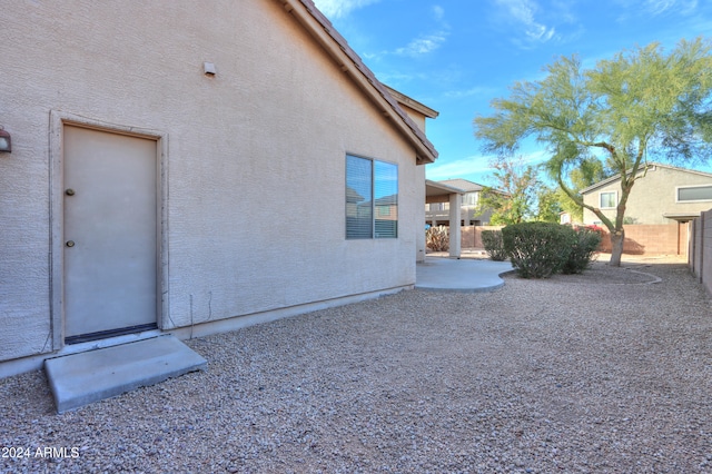 view of side of home featuring a patio area