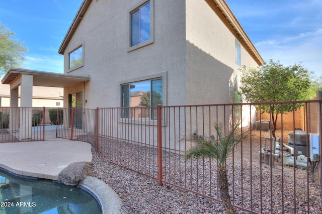 back of house with a patio