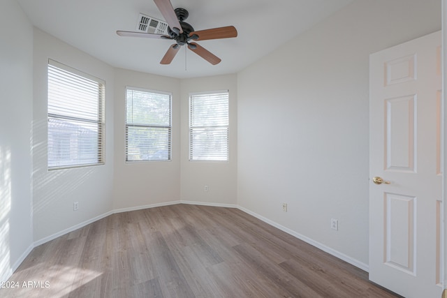 unfurnished room featuring ceiling fan and light hardwood / wood-style floors