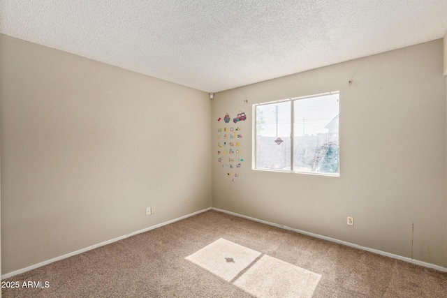 4624 S Fair Ln, Tempe, AZ 85282 - carpeted empty room with a textured ceiling and baseboards