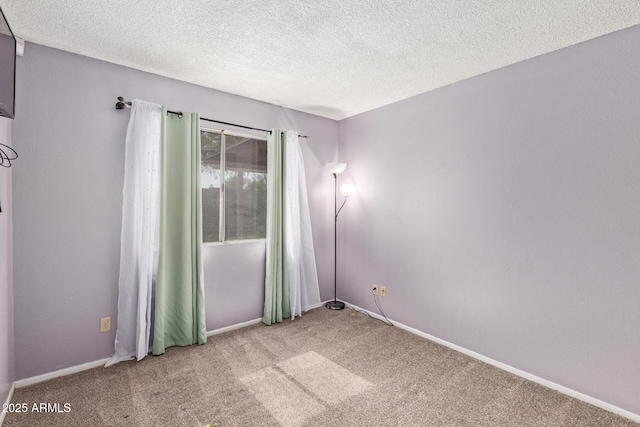 4624 S Fair Ln, Tempe, AZ 85282 - empty room with carpet flooring, a textured ceiling, and baseboards