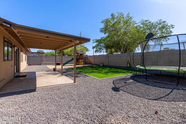 4624 S Fair Ln, Tempe, AZ 85282 - view of yard with a trampoline, a patio area, and a playground