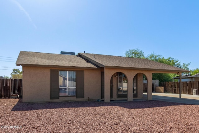 4624 S Fair Ln, Tempe, AZ 85282 - back of property with a patio area, stucco siding, and a shingled roof