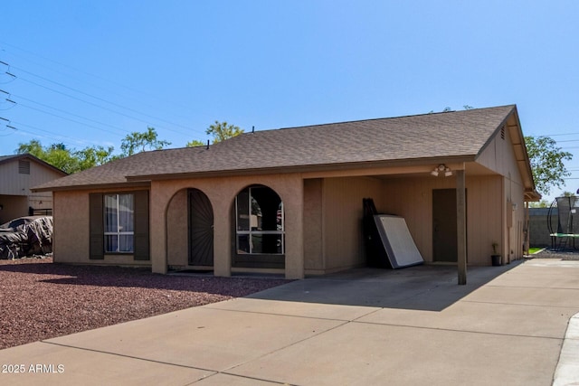 4624 S Fair Ln, Tempe, AZ 85282 - view of front of house featuring a trampoline, a shingled roof, and concrete driveway