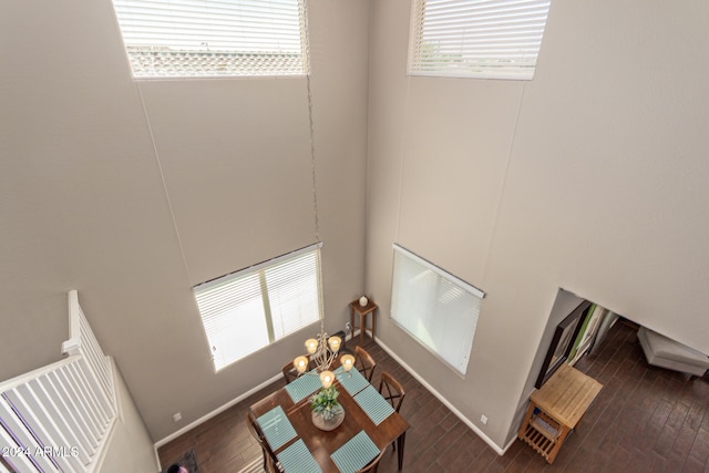 living room featuring plenty of natural light and dark hardwood / wood-style flooring