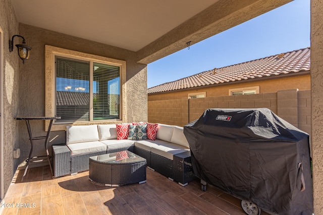 view of patio with a deck, a grill, and an outdoor hangout area