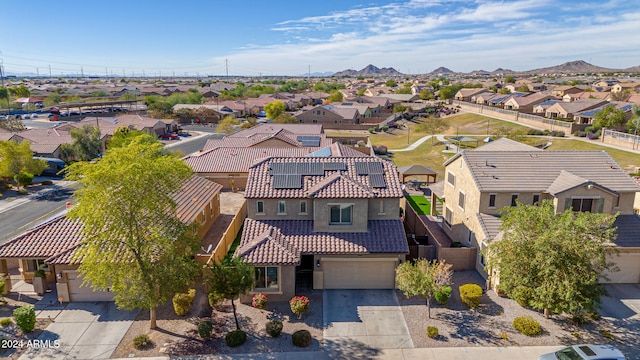 birds eye view of property featuring a mountain view