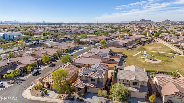 birds eye view of property with a mountain view